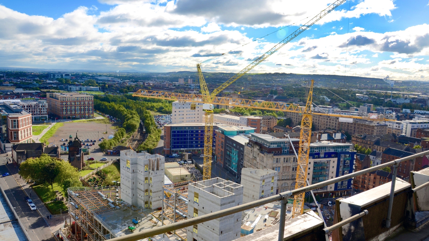Image of a construction site showing cranes and buildings in progress stock image for why scape procurement banner